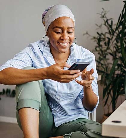 Woman using phone at home