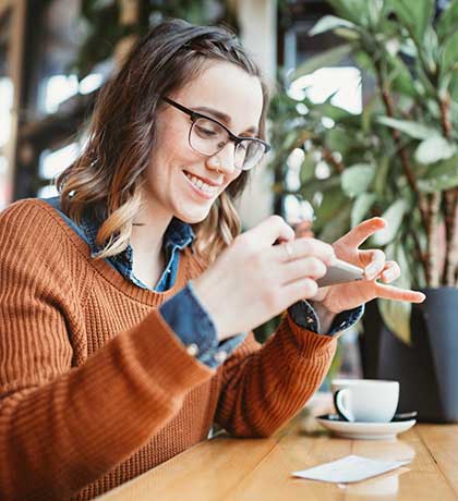 Woman taking photo of check